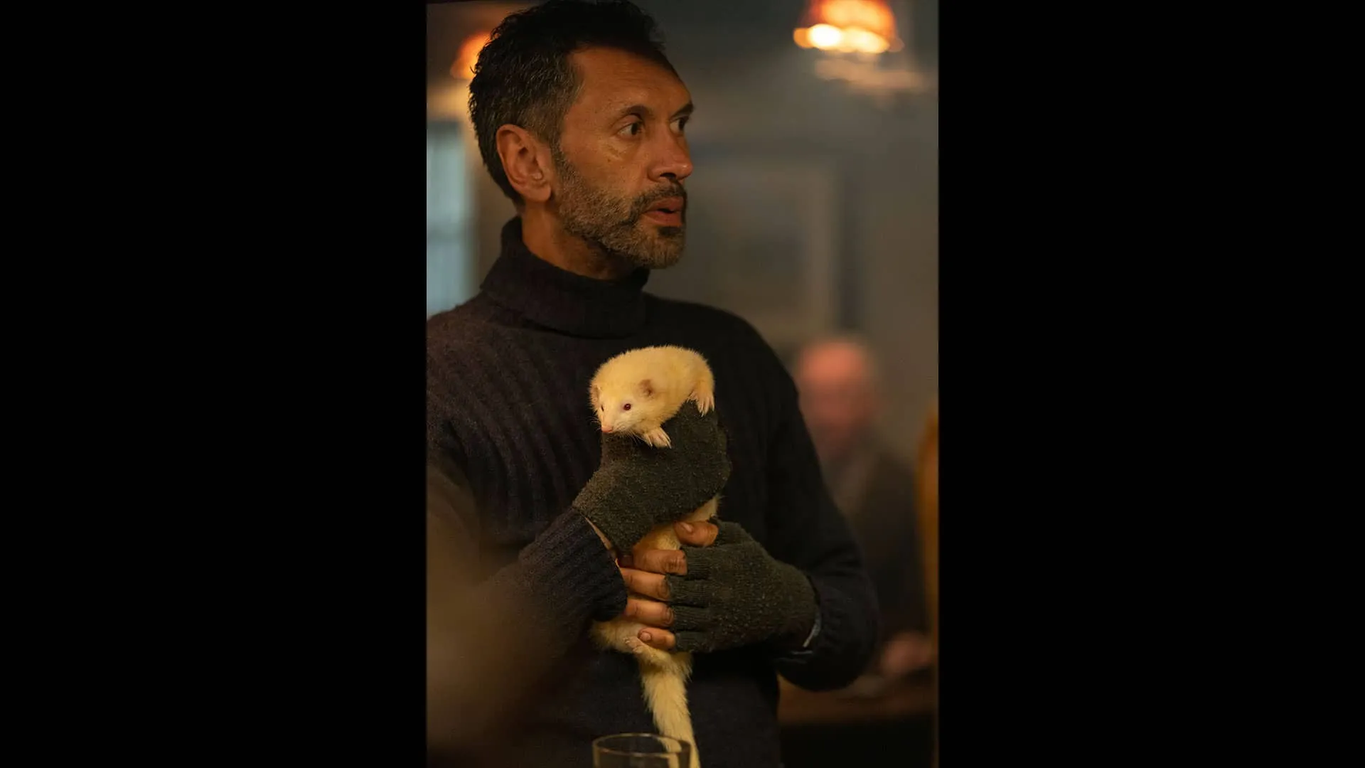 In the Drovers pub, Joe Coney holds his white ferret, Wilf